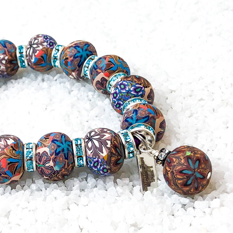 To emerge in illuminating light.