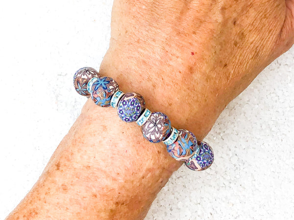 To emerge in illuminating light.