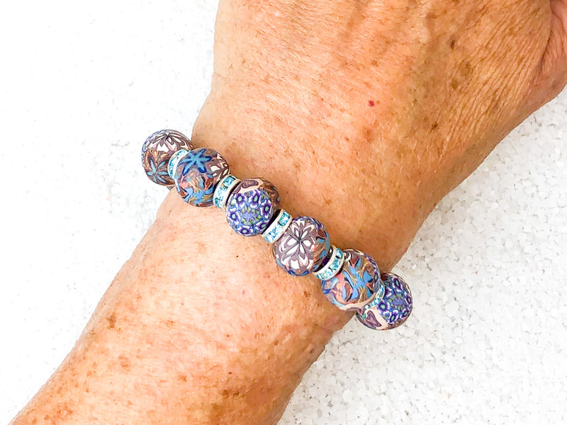 To emerge in illuminating light.