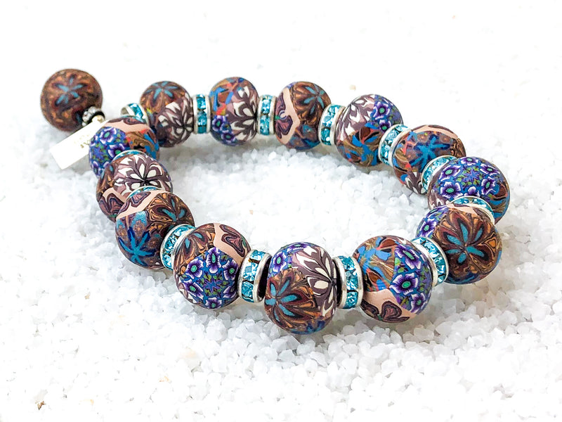 To emerge in illuminating light.